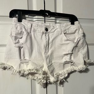 White ripped white jean shorts. Worn once.